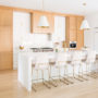 a contemporary kitchen with light oak cabinets and benjamin moore white heron wall paint