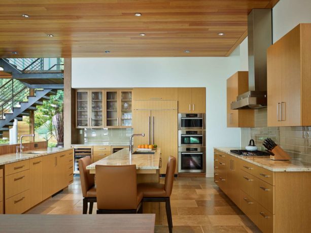 a contemporary kitchen with rift white oak cabinets, stainless steel appliances, and benjamin moore white dove wall paint