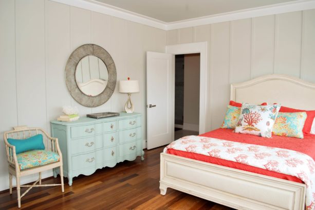 a coral and light blue beach-style bedroom