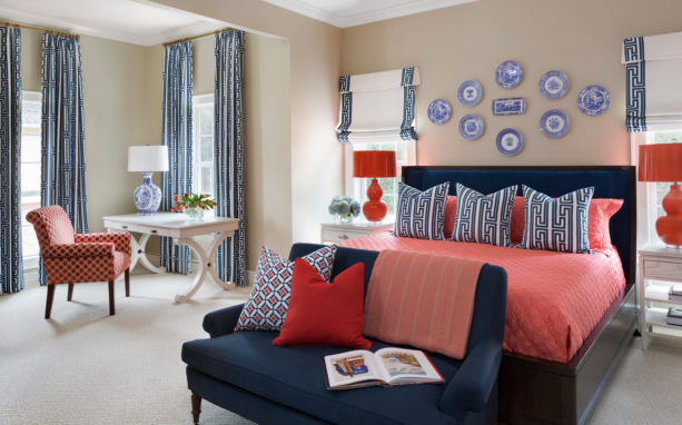 a relaxing sensation in a transitional bedroom with coral, navy and khaki colors