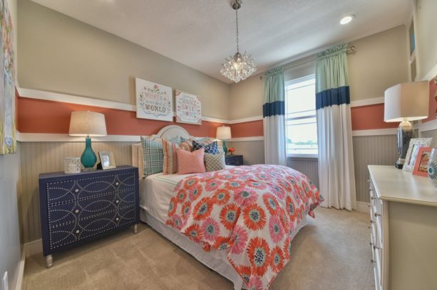 a traditional bedroom with cozy atmosphere from coral, indigo blue, and beige color combination