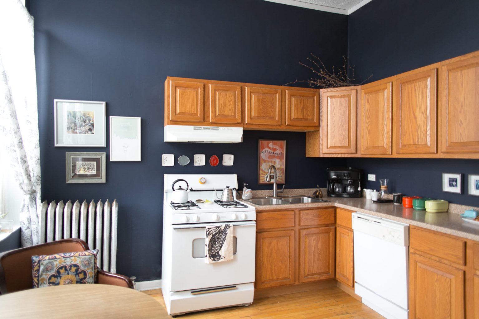 blue kitchen wall with honey oak cabinet