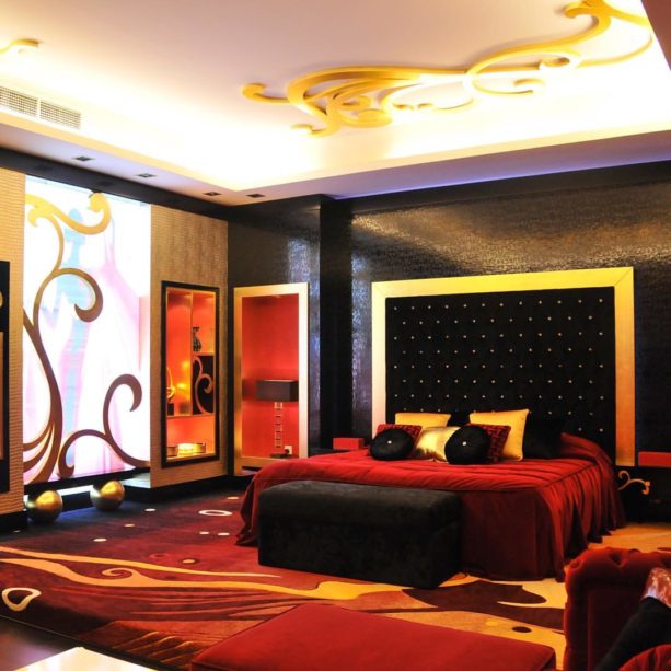 a luxurious red, black, and gold bedroom decor