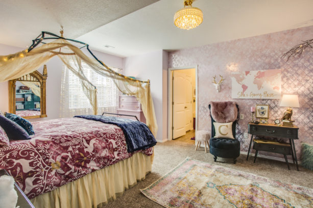 a shabby chic girl bedroom with pink and mauve purple theme