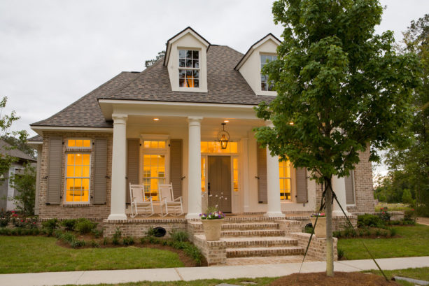 tan and white home exterior with beige shutters