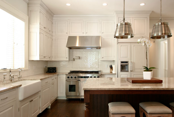 white subway tile with antique white grout for the backsplash in a traditional kitchen