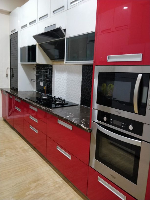 black countertops with white veins for red kitchen cabinets