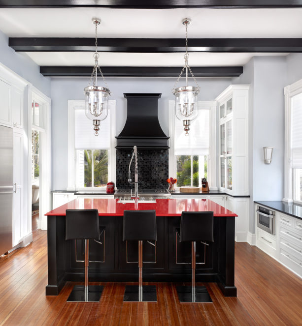black island with red quartz top for adding elegance in your kitchen