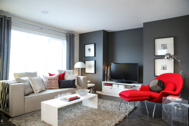 a set of bright red chair and ottoman for creating a focal point in grey living room