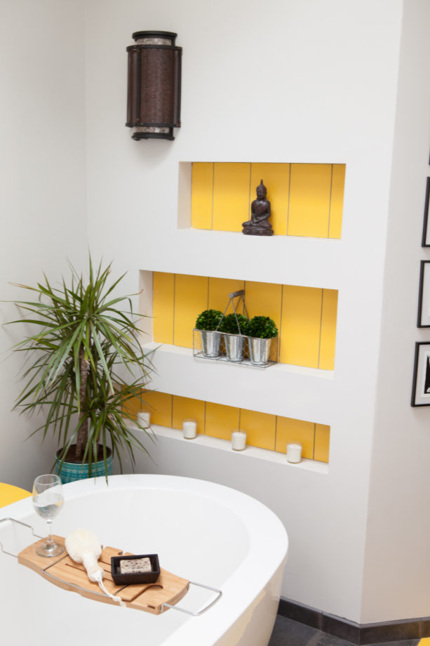 custom yellow niche in a light grey bathroom wall design