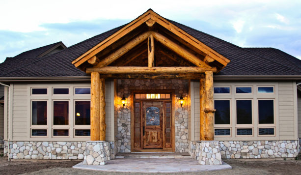 front entry door from stained wood material for a rustic-style house