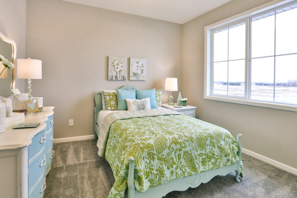 a girl’s bedroom with the combination of lime green, mid gray, and sapphire blue colors