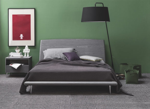 a minimalist contemporary bedroom that looks bold with dark gray and green colors
