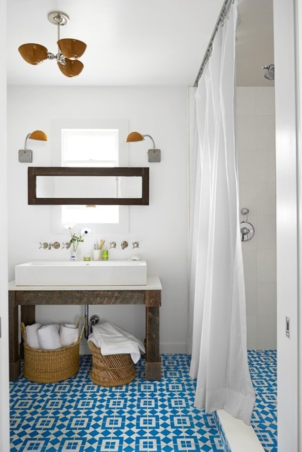 a country bathroom with a perfect combination of graphic blue tile and white wall