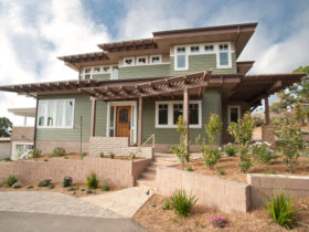 an idea for transitional ranch style design with flat roof and vinyl siding