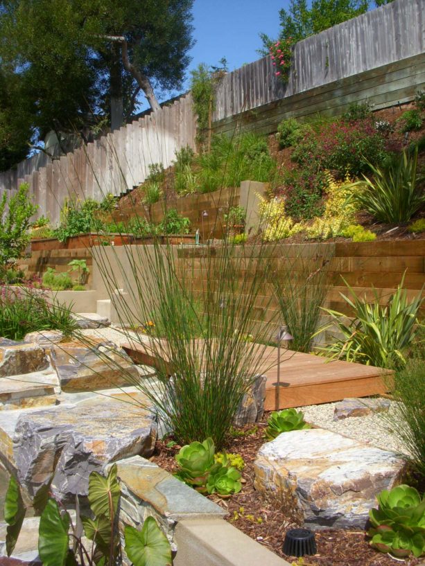 modern hillside retaining wall with planted steep slopes