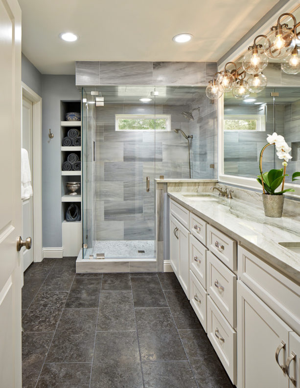 modern master bathroom without tub featuring a long vanity and quartzite countertops