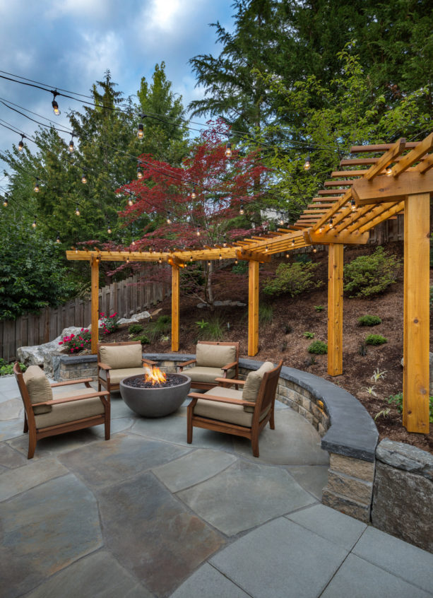 retaining wall doubles as overflow seating area in steep slopes