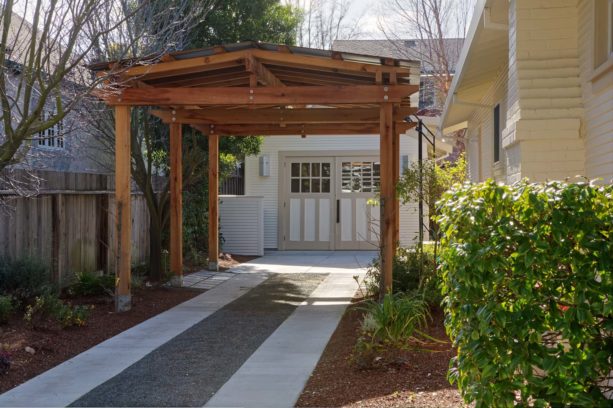traditional carport idea in front of a vintage garage