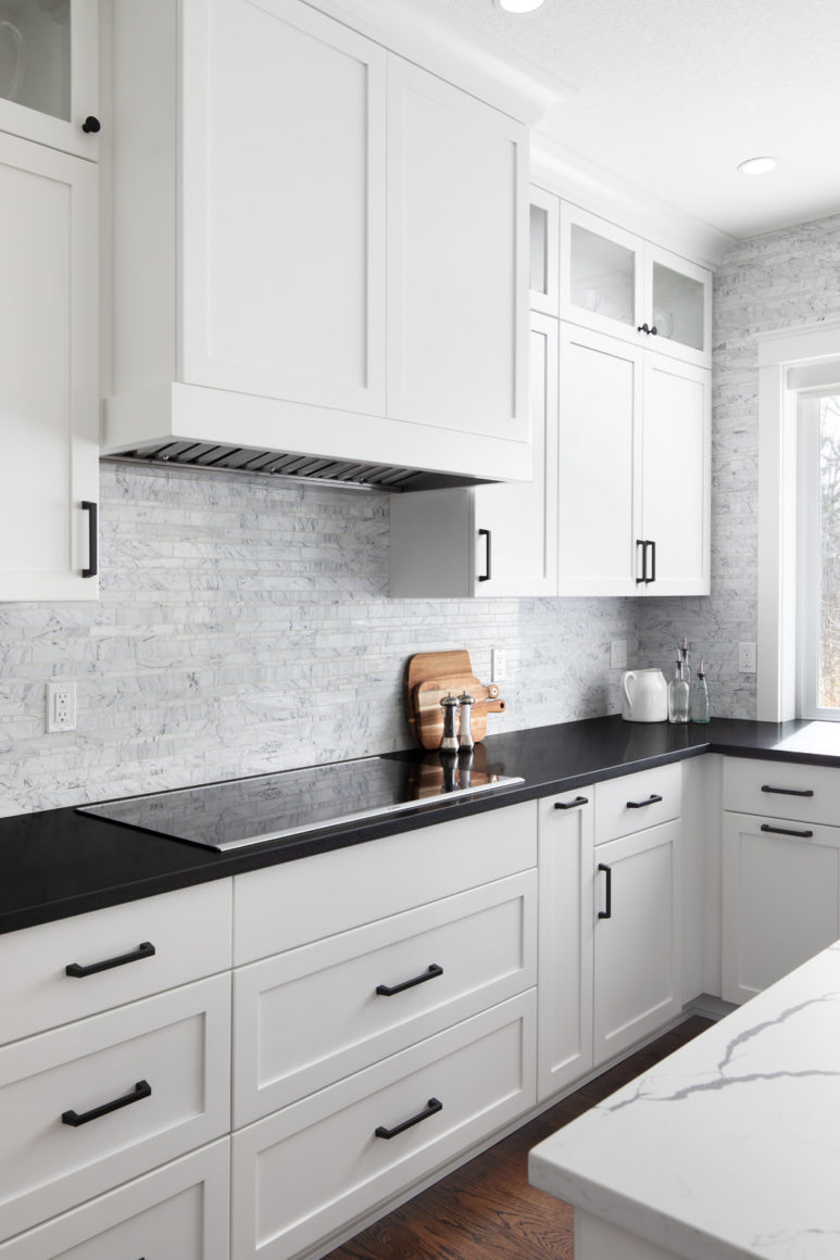 U Shaped Shaker White Cabinets And Black Granite Countertops In A Contemporary Kitchen 773x1160 