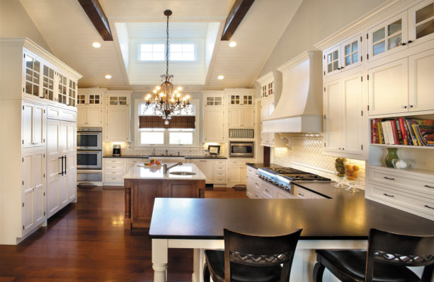 vintage look in a traditional kitchen with a slight of contemporary style from white cabinets and black wood countertops