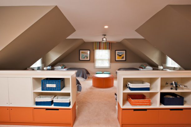 comfortable four-bed attic bedroom with slanted walls above the beds