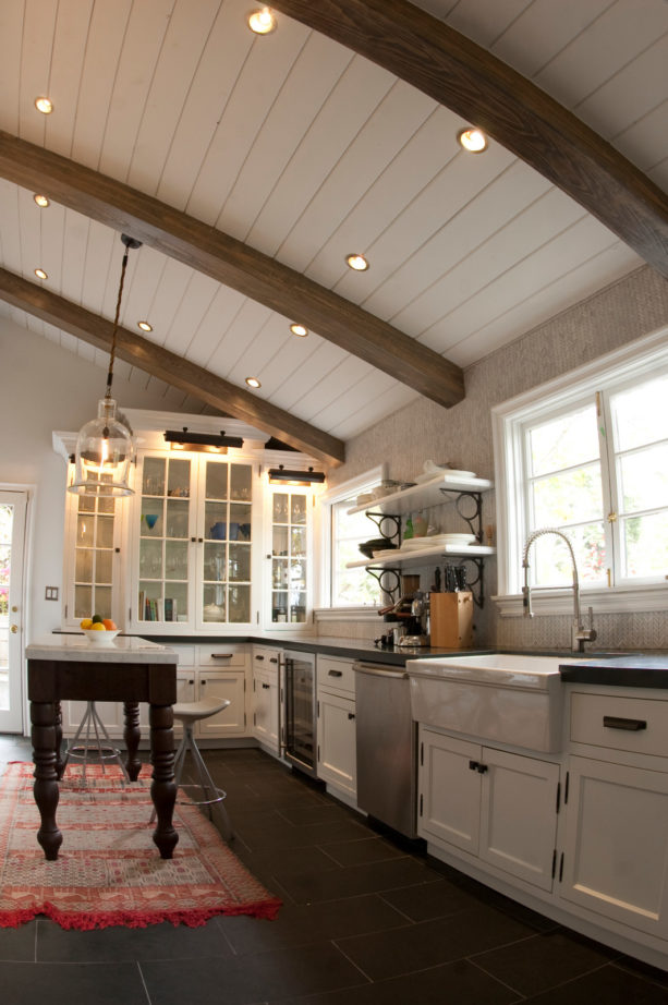 maple white floor to ceiling cabinets in a mountain style kitchen