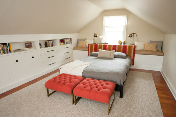mid-sized transitional attic bedroom with beige slanted walls