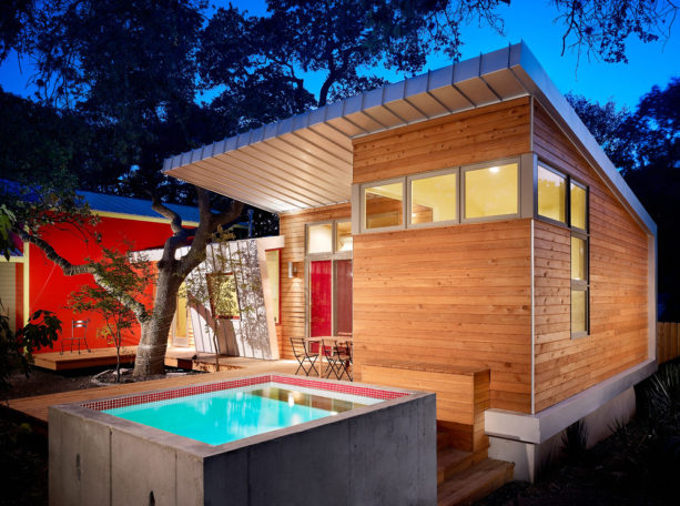 galvanized metal roof house mixed with red color and stained cedar siding combination