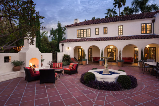 large tuscan style courtyard in a two-story colonial spanish home