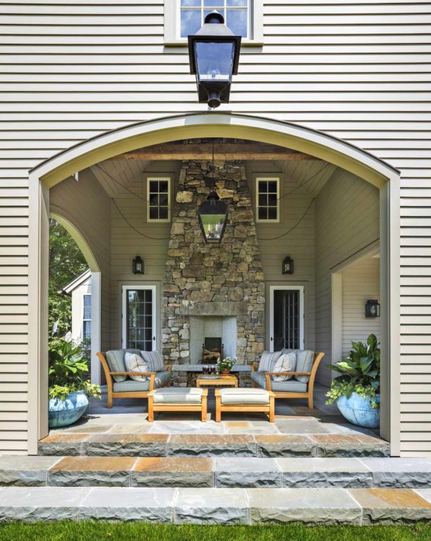classic bluestone covered patio with traditional fieldstone fireplace