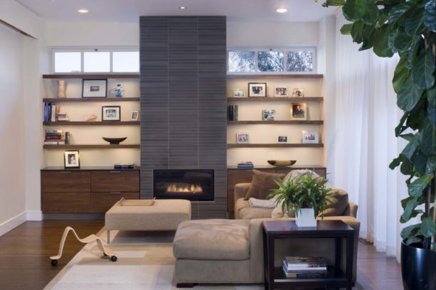 contemporary living room with a tile fireplace in a bookshelves wall unit