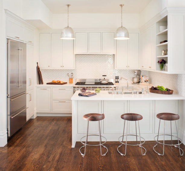 kitchen peninsula with caesarstone countertops and modern low back stools seating
