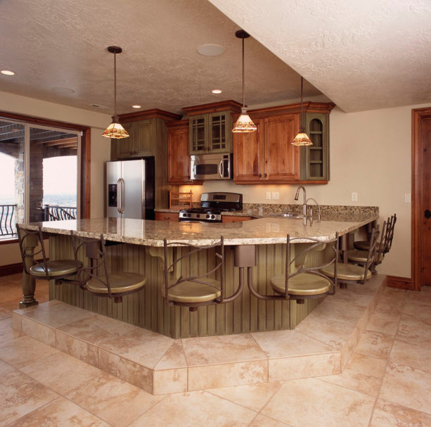 kitchen peninsula with granite countertops and contemporary pine stools seating