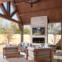 modern patio with outdoor gas fireplace and wall mounted tv