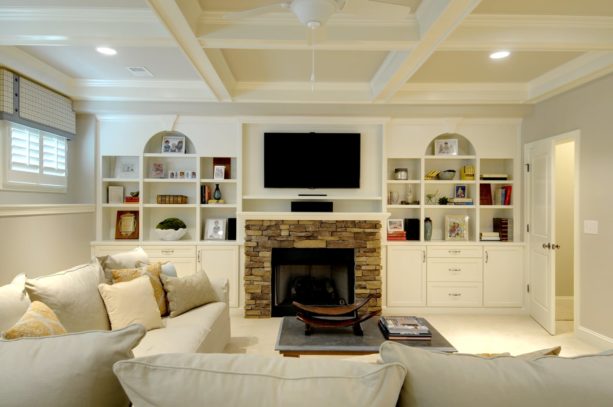 polished white wall unit with stone standard fireplace