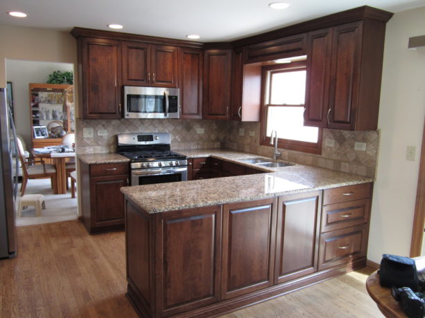 small traditional u-shaped kitchen with a peninsula and cherry cabinetry