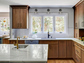 transitional l-shaped kitchen with an undermount sink and casement windows over