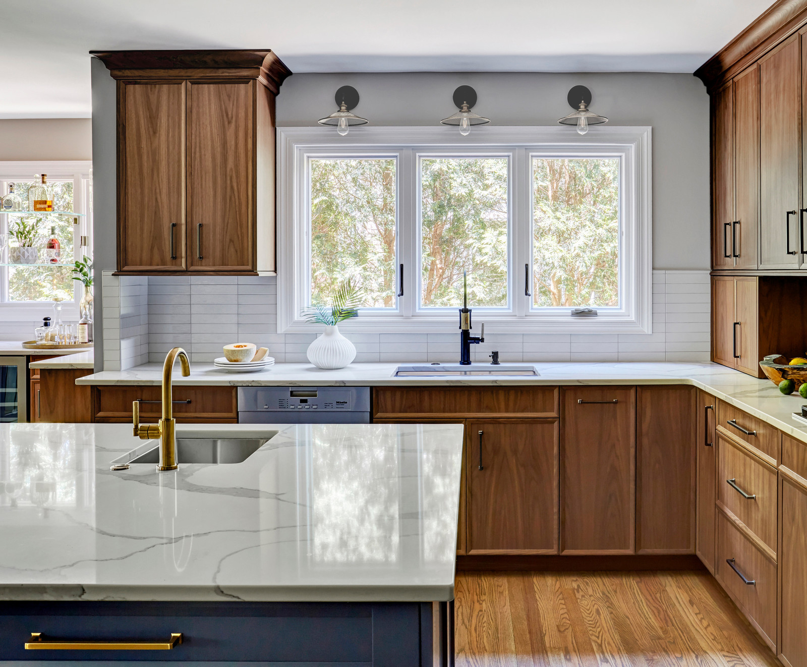 Transitional L Shaped Kitchen With An Undermount Sink And Casement Windows Over 