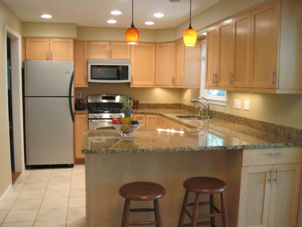 u-shaped transitional kitchen with ceramic tile and a peninsula