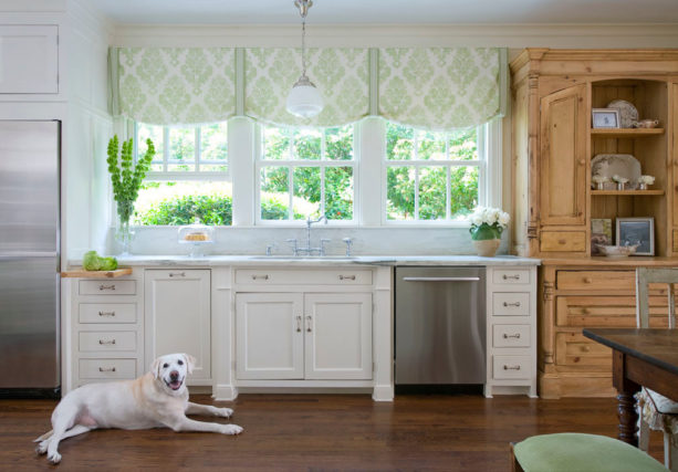 vintage kitchen with a cast iron sink and triple hung windows over