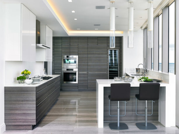 white quartz countertops kitchen peninsula with dark adjustable stools seating