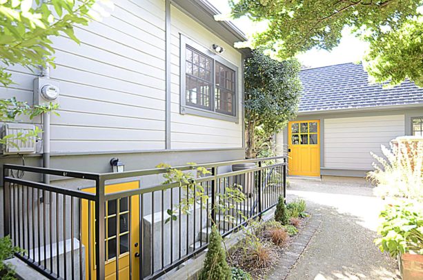 bright yellow dutch walkout basement door option for a fun element in the exterior