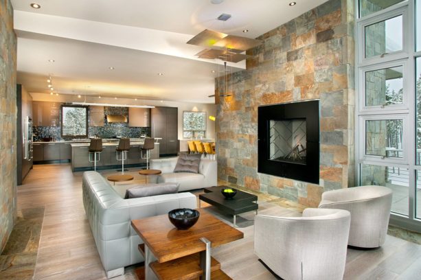 dark grey trendy kitchen and silver contemporary living room combo