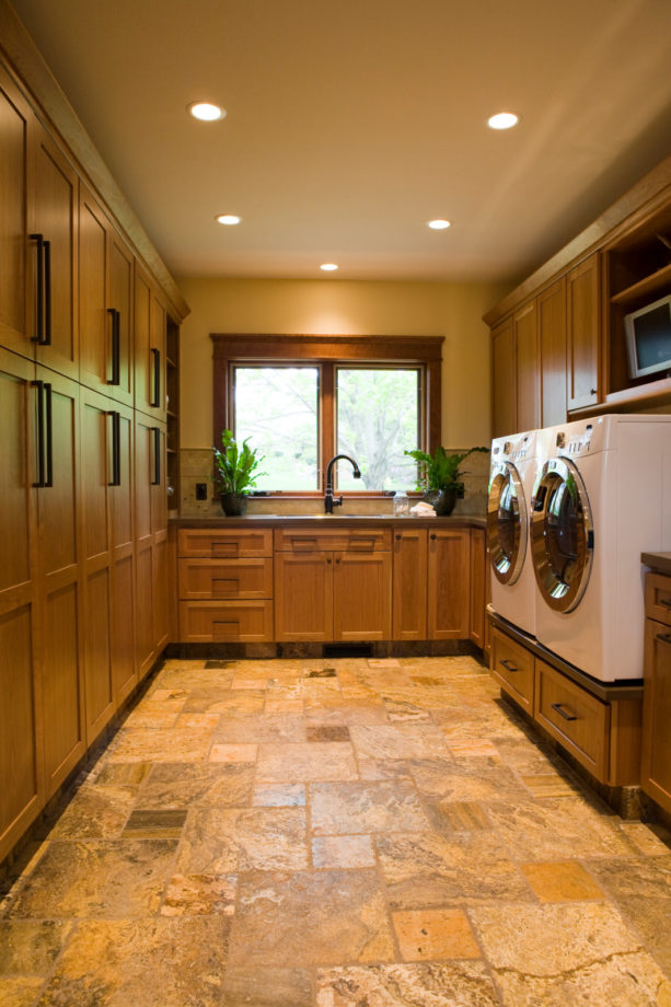 travertine tile laundry room floor to give a soft neutral tone