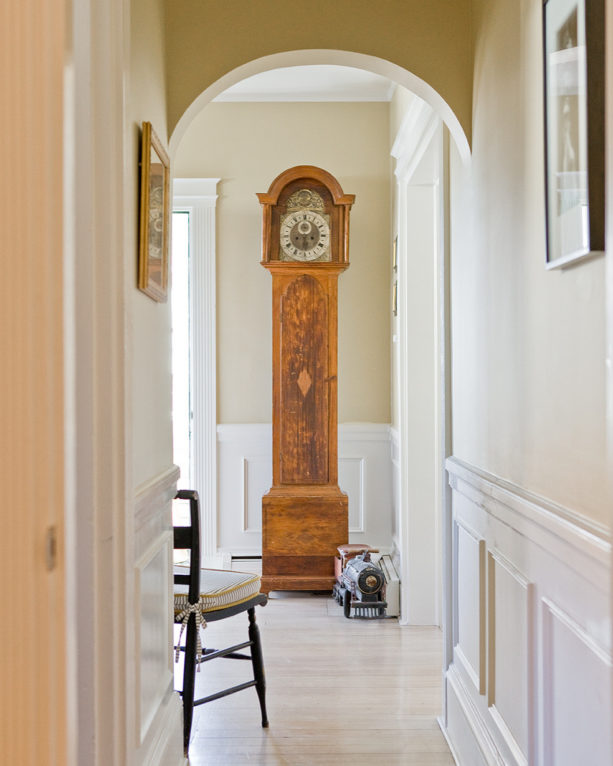 arched traditional small entryway with light wood flooring idea
