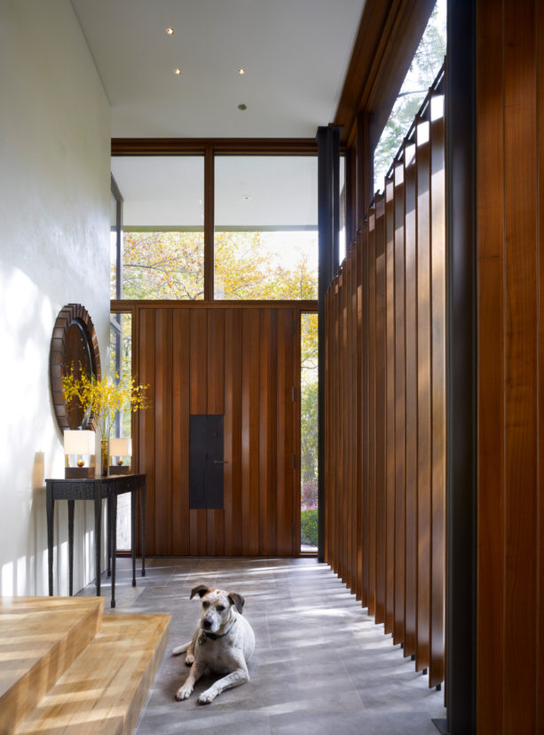 enclosed entrance with huge vertical wood slat wall