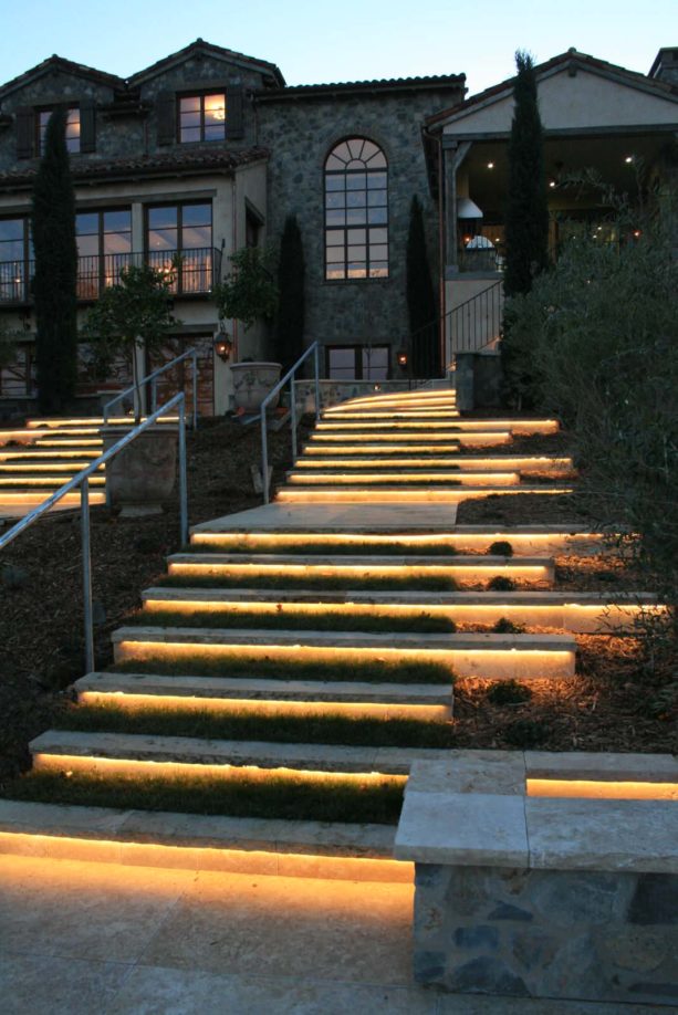 led outdoor lighting underneath the walnut travertine stair