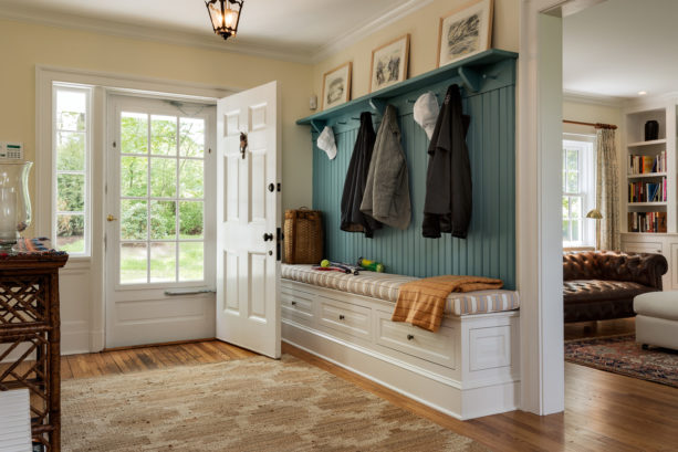 open small entryway with strip oak flooring
