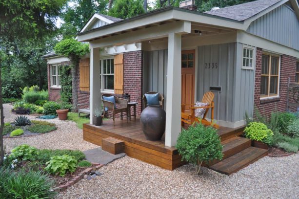 tiny front porch with decking and seating area in a ranch style home